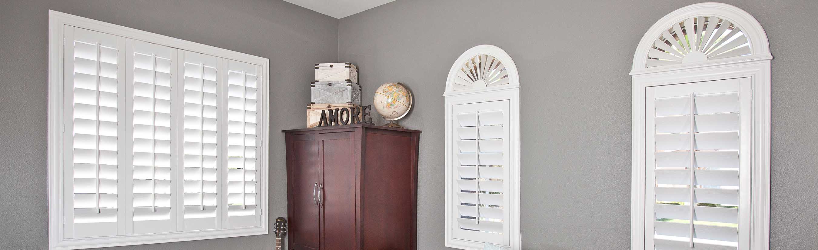 White arched shutters in a teen bedroom.