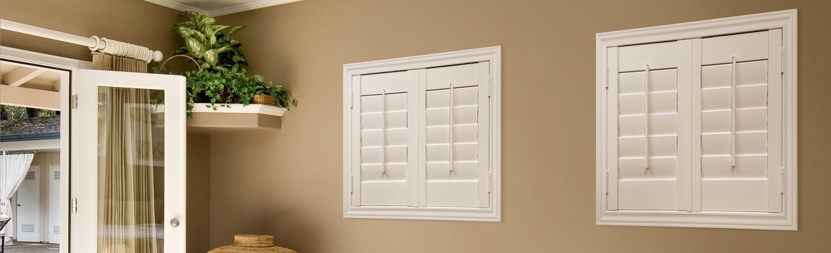 White shutters in a kitchen entrance.